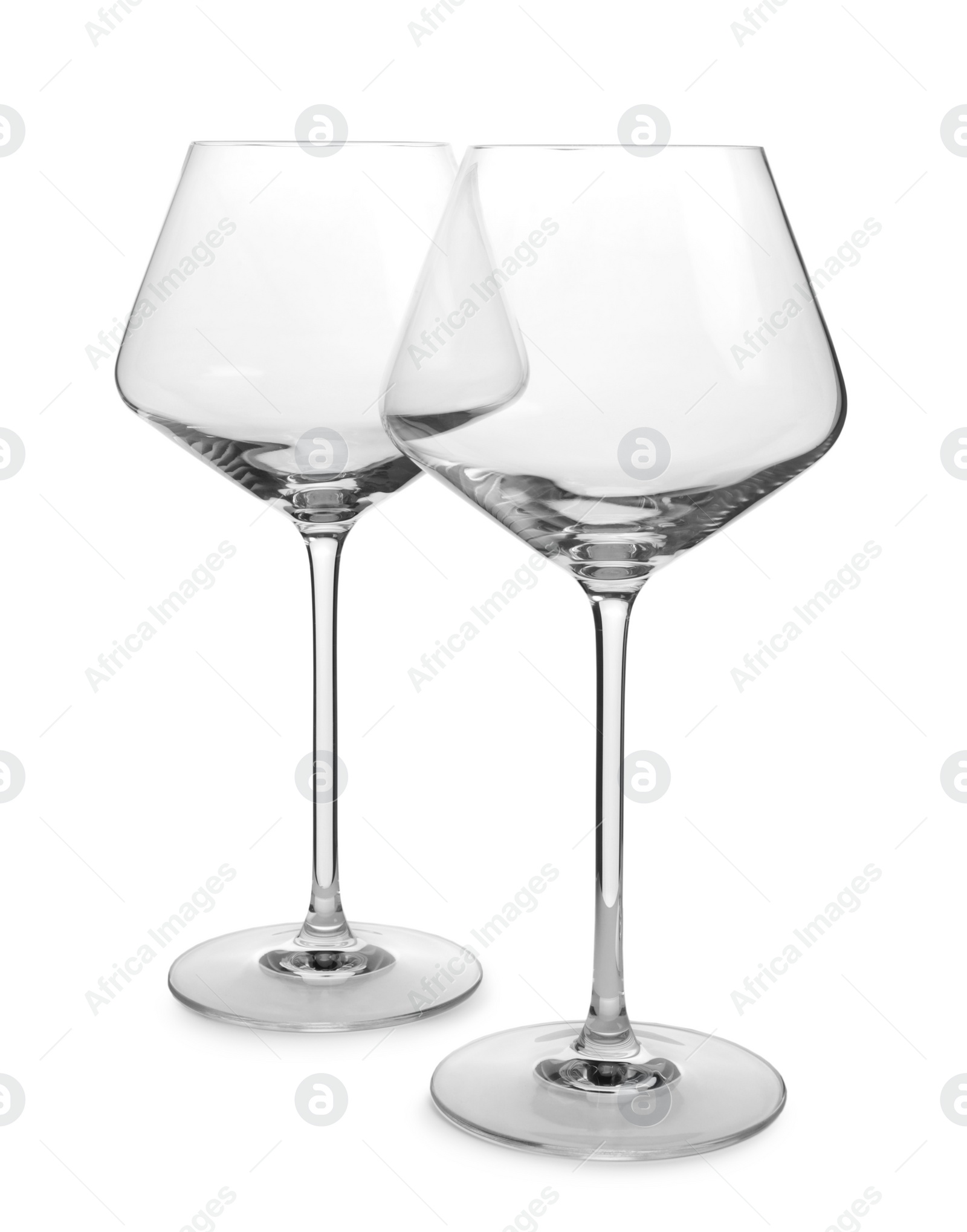 Photo of Elegant clean empty wine glasses isolated on white