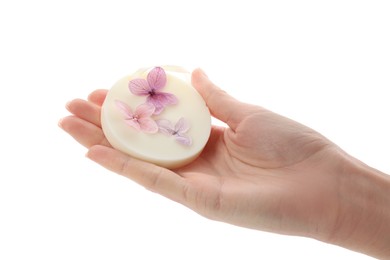 Woman holding scented sachet with flowers on white background, closeup