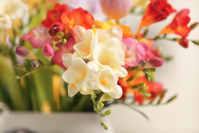 Photo of Beautiful bouquet of freesia flowers, closeup