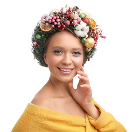 Photo of Beautiful young woman wearing Christmas wreath on white background