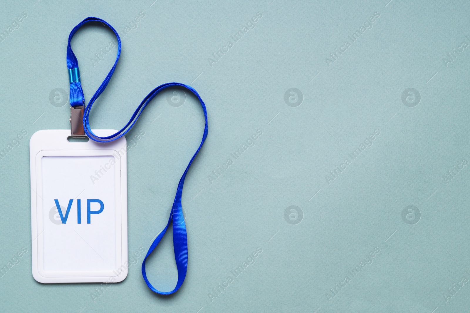 Photo of Plastic vip badge on light background, top view. Space for text