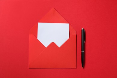 Photo of Blank sheet of paper, letter envelope and pen on red background, top view. Space for text