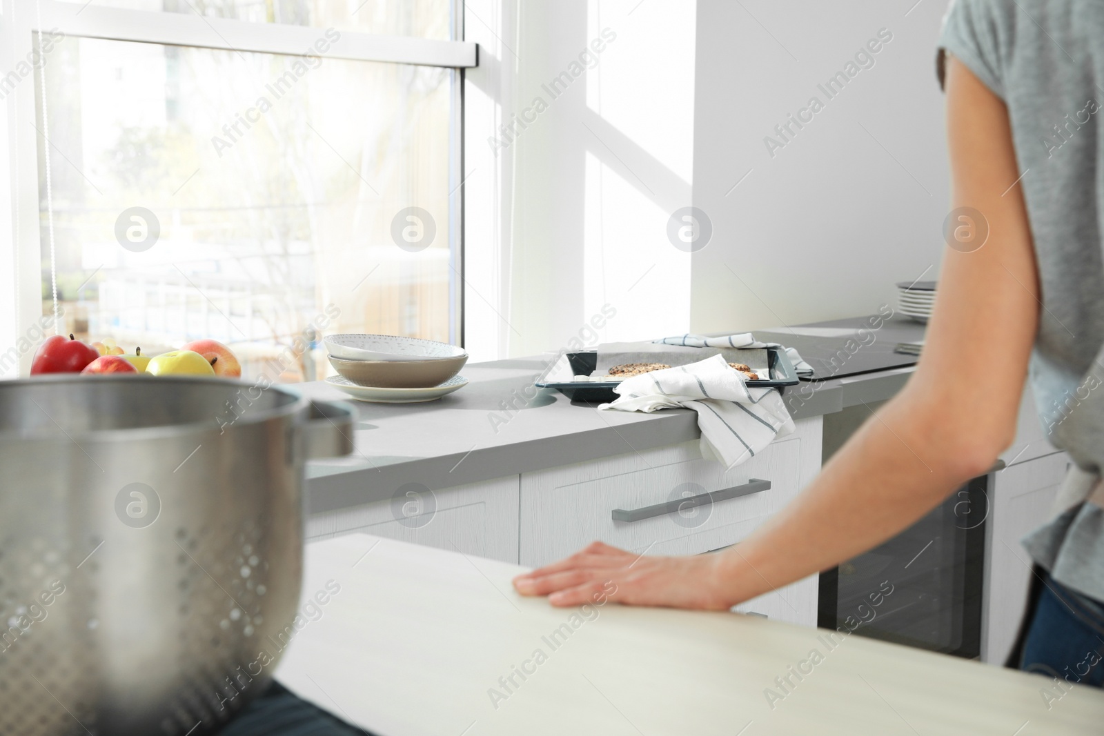 Photo of Oven sheet with homemade cookies on counter in kitchen