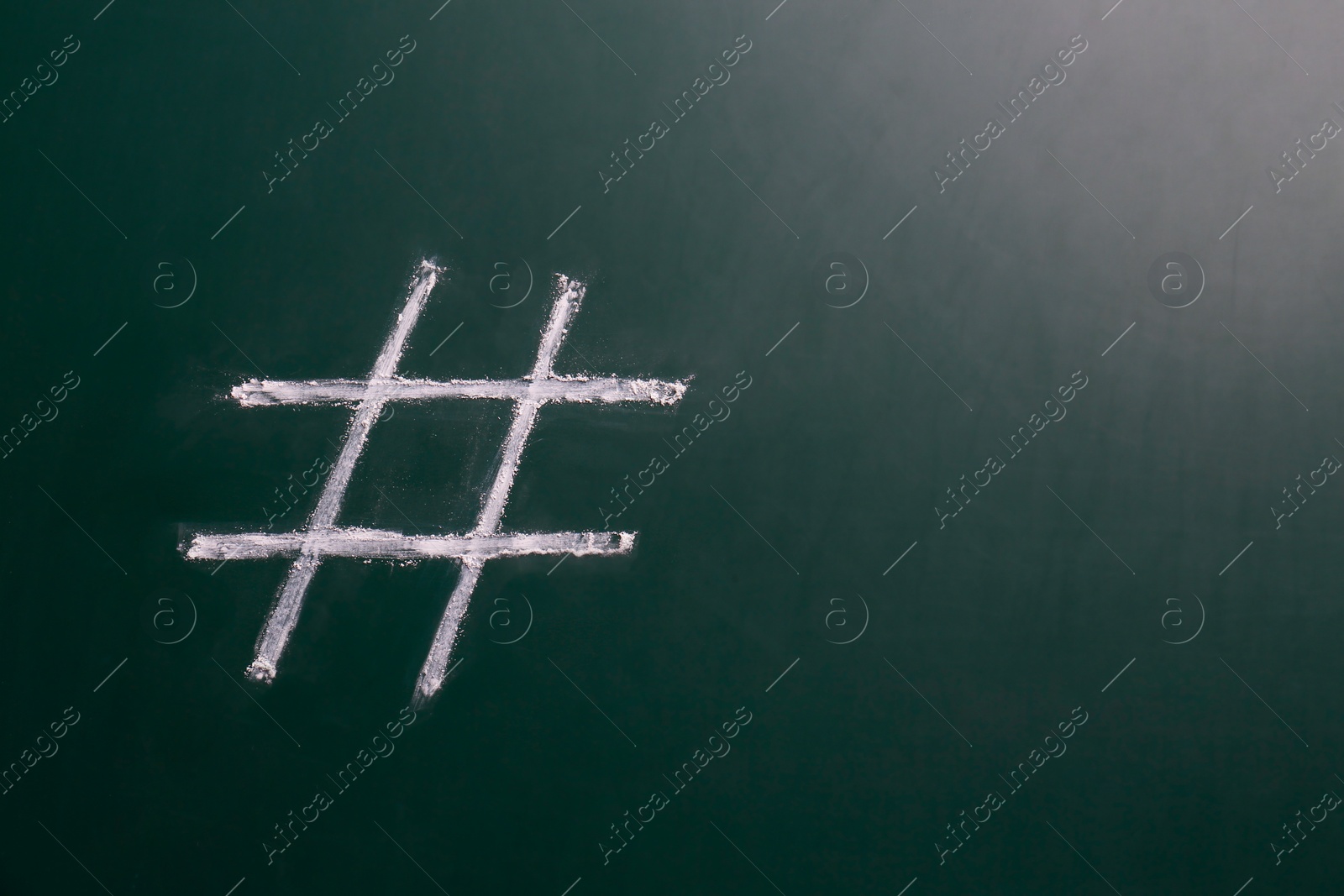 Photo of Hashtag symbol drawn with chalk on blackboard. Space for text