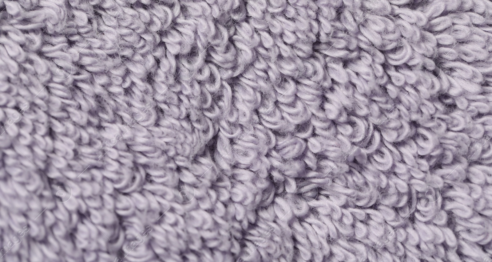 Photo of Texture of soft violet fabric as background, top view