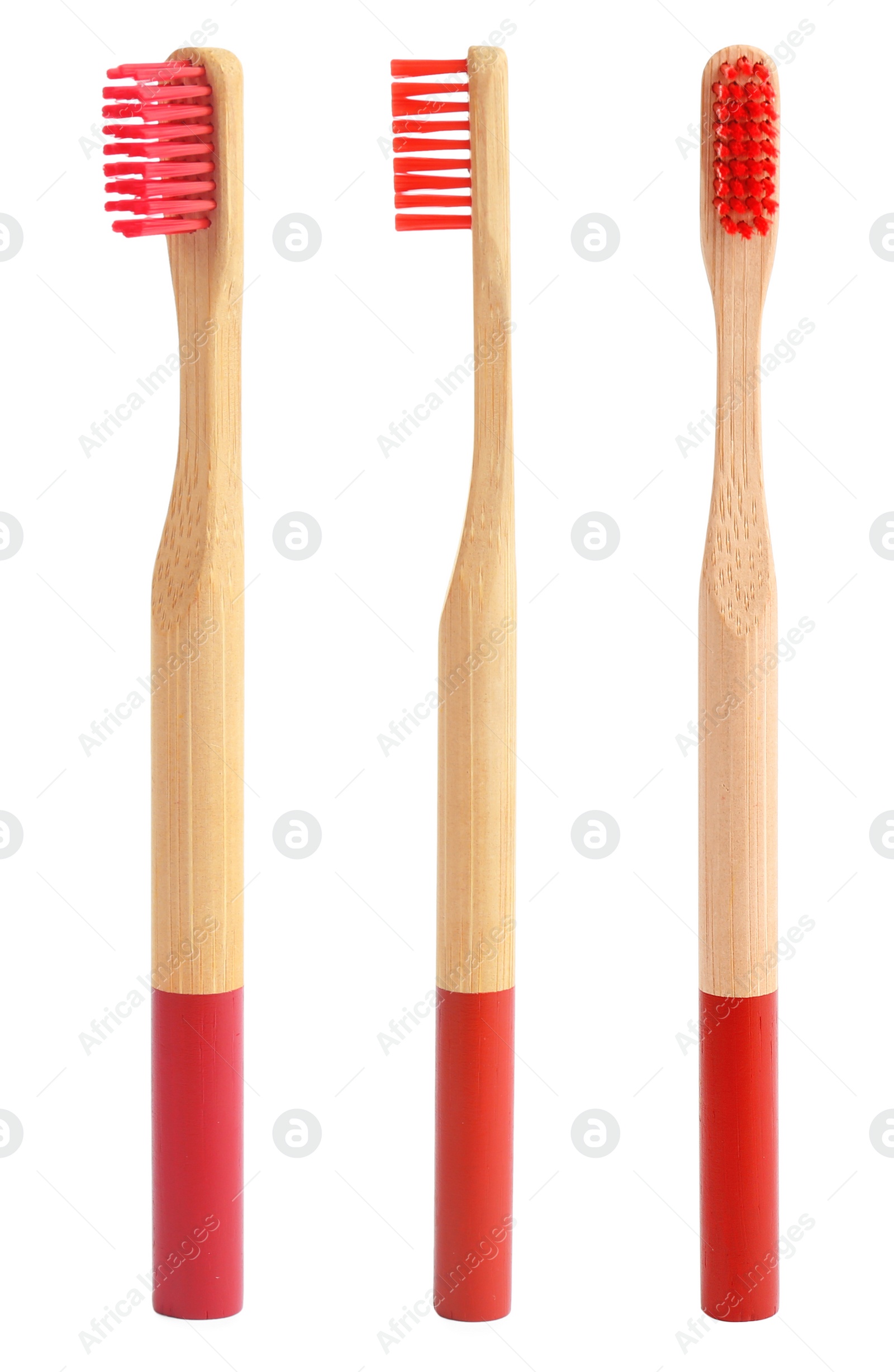 Image of Set of bamboo toothbrushes with red bristles on white background 