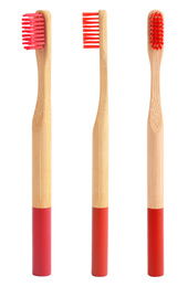 Image of Set of bamboo toothbrushes with red bristles on white background 