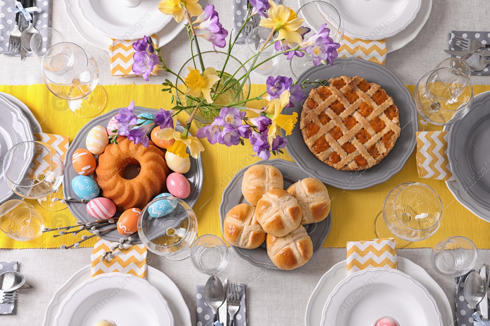 Photo of Festive Easter table setting with traditional meal, top view