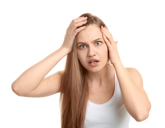 Young woman with hair loss problem on white background