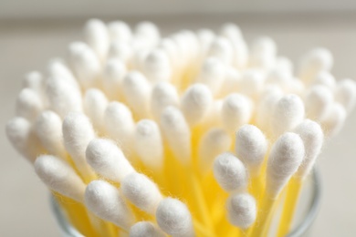 Cotton swabs on grey background, closeup view