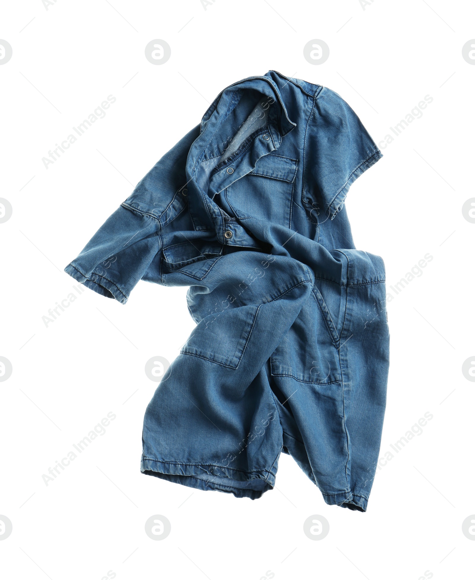 Photo of Rumpled denim romper isolated on white. Messy clothes