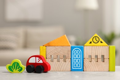 Set of wooden toys on light grey table indoors, closeup. Children's development