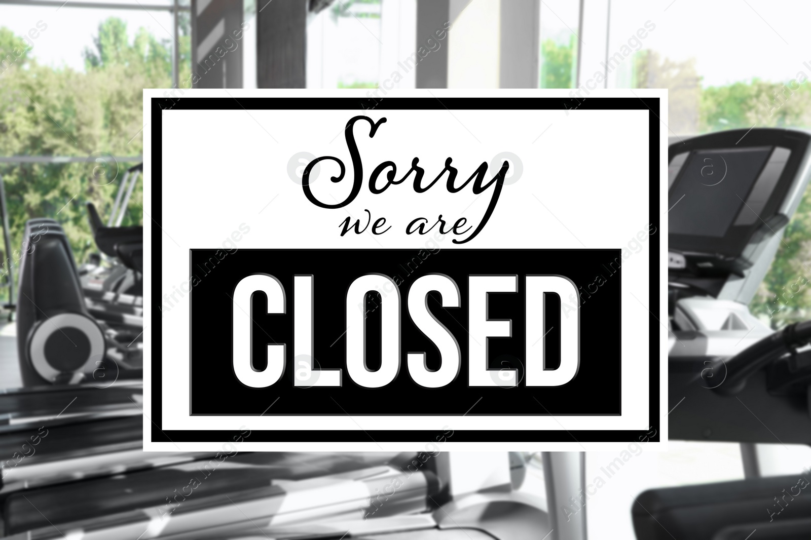 Image of Sorry we are closed sign against blurred background