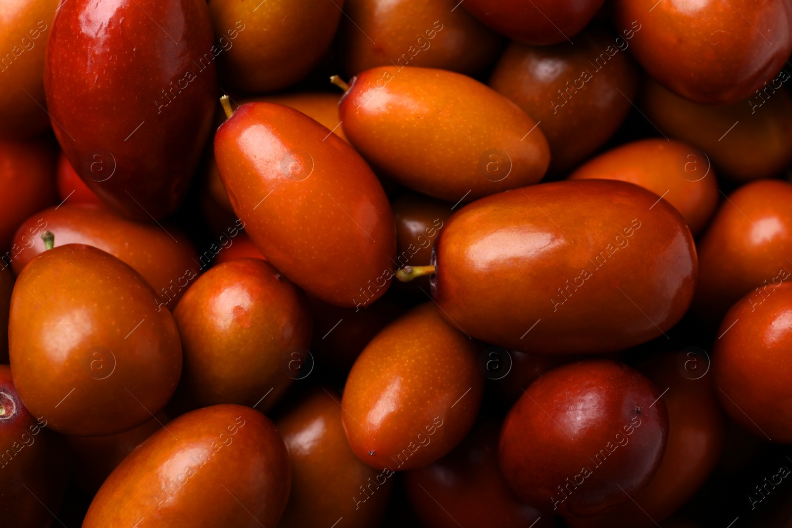 Photo of Closeup view of fresh Ziziphus jujuba fruits as background