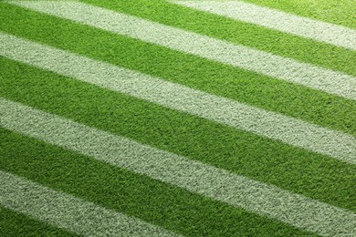 Image of Green grass with white markings, closeup view