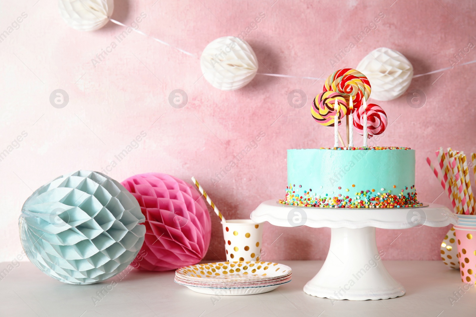 Photo of Stand with fresh delicious cake and birthday decorations on table. Space for text