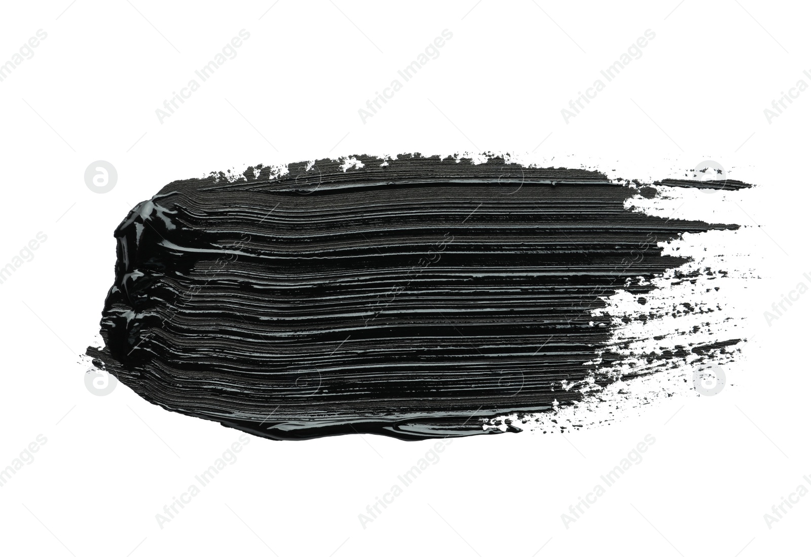 Photo of Brushstrokes of black oil paint on white background, top view