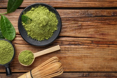 Photo of Flat lay composition with green matcha powder on wooden table, space for text