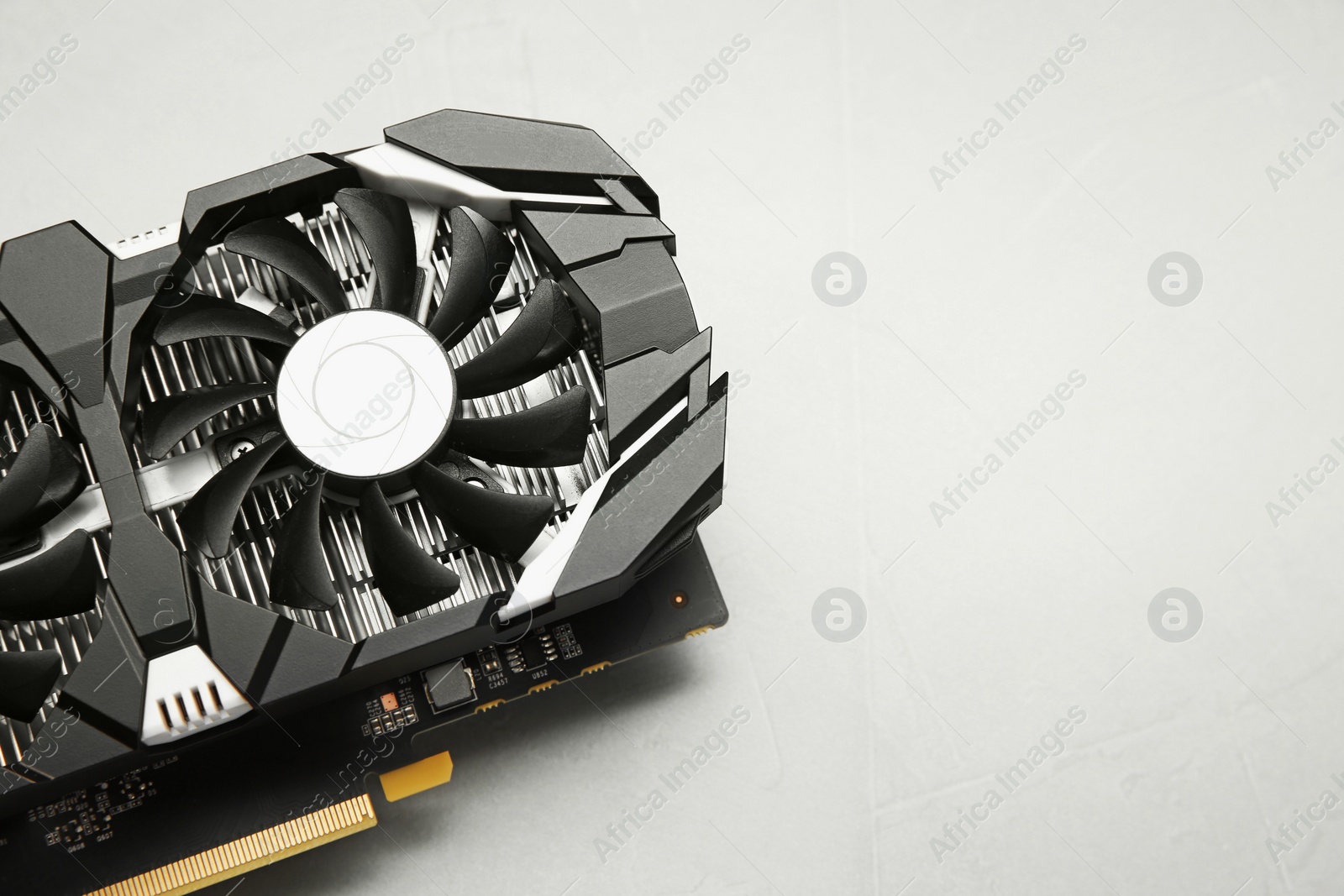 Photo of Computer graphics card on gray textured background, top view. Space for text