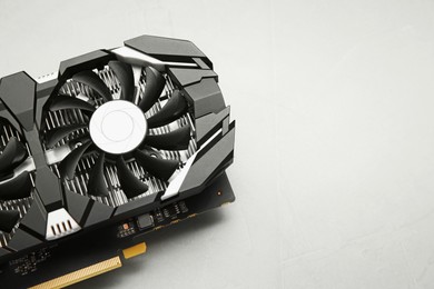 Computer graphics card on gray textured background, top view. Space for text