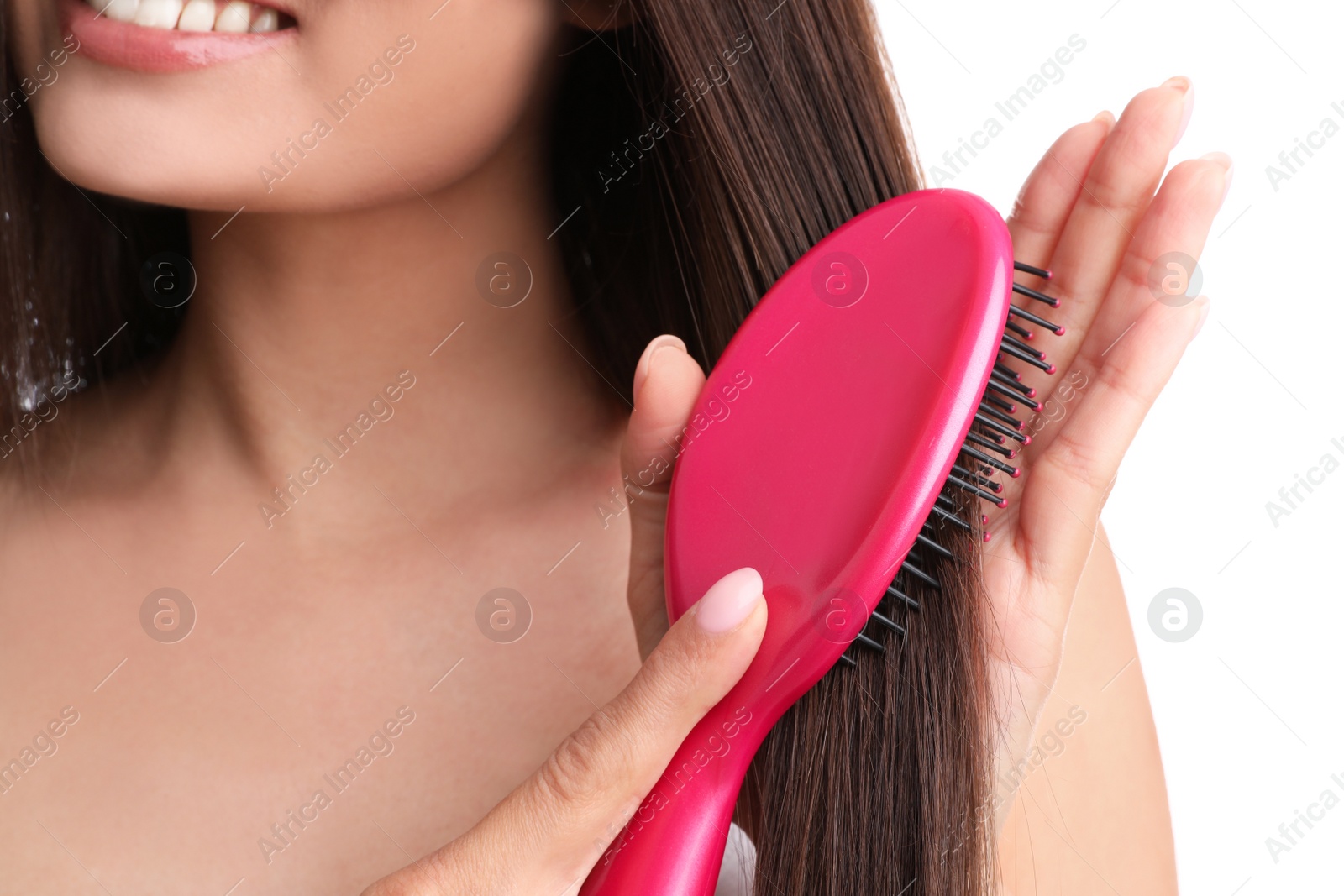 Photo of Woman with hair brush on white background, closeup