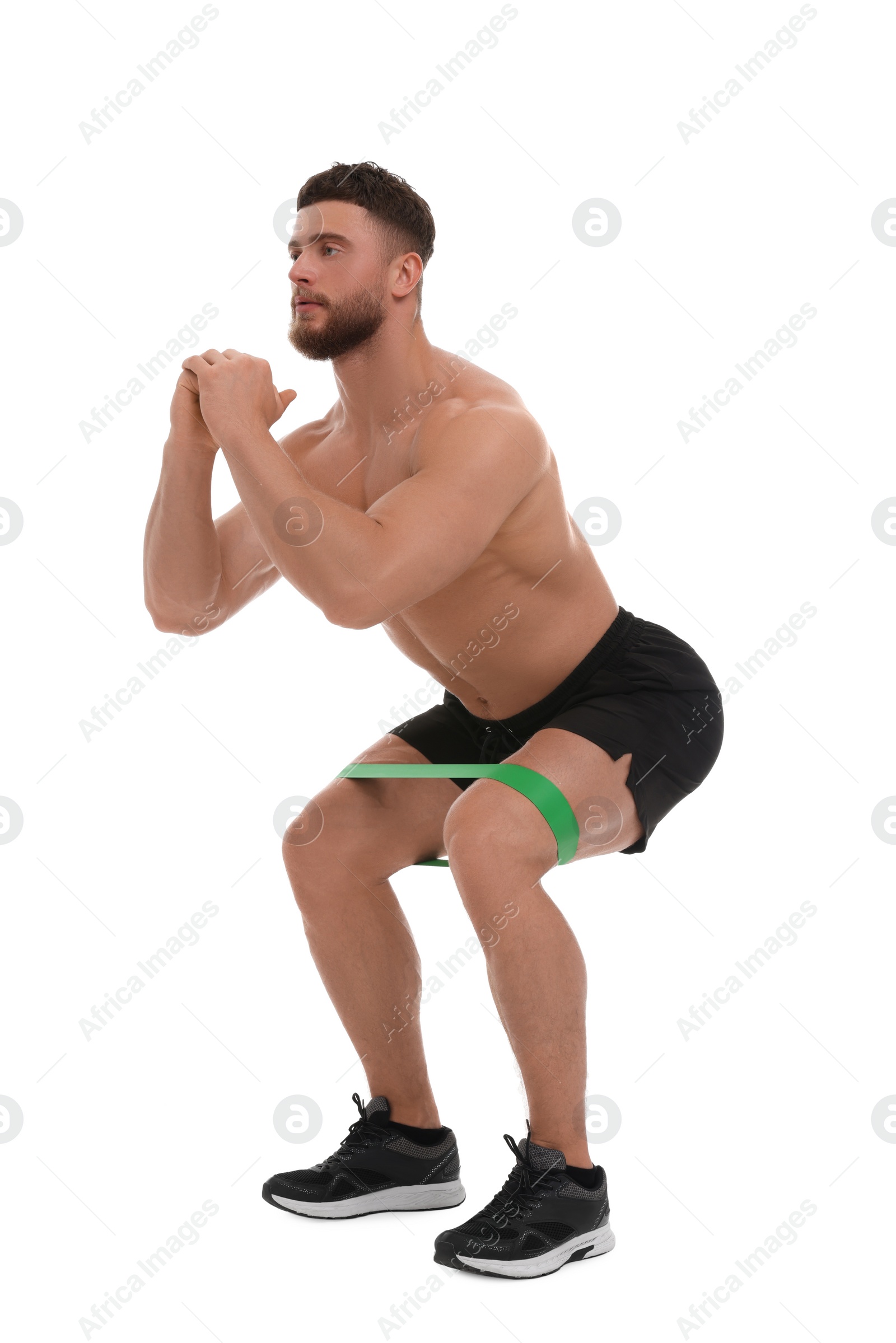 Photo of Young man exercising with elastic resistance band on white background