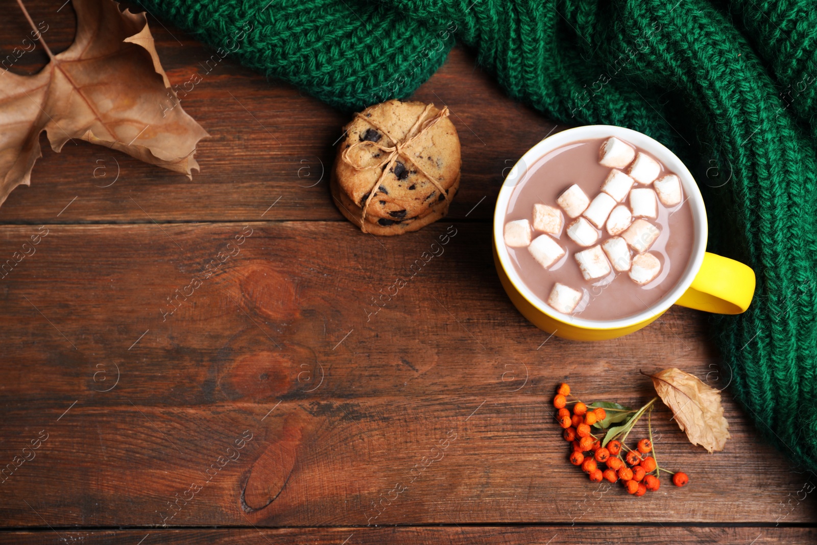 Photo of Flat lay composition with cup of hot drink on wooden table, space for text. Cozy autumn atmosphere