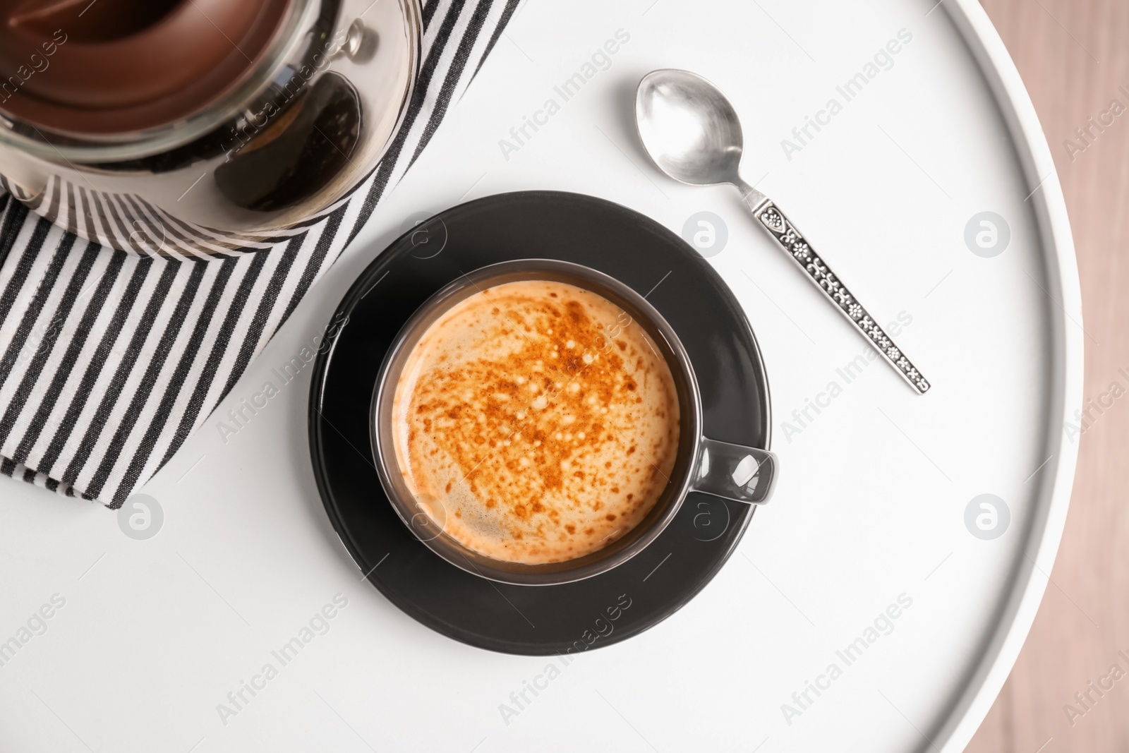 Photo of Cup of aromatic hot coffee on table, top view