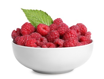 Bowl of fresh ripe raspberries with green leaf isolated on white