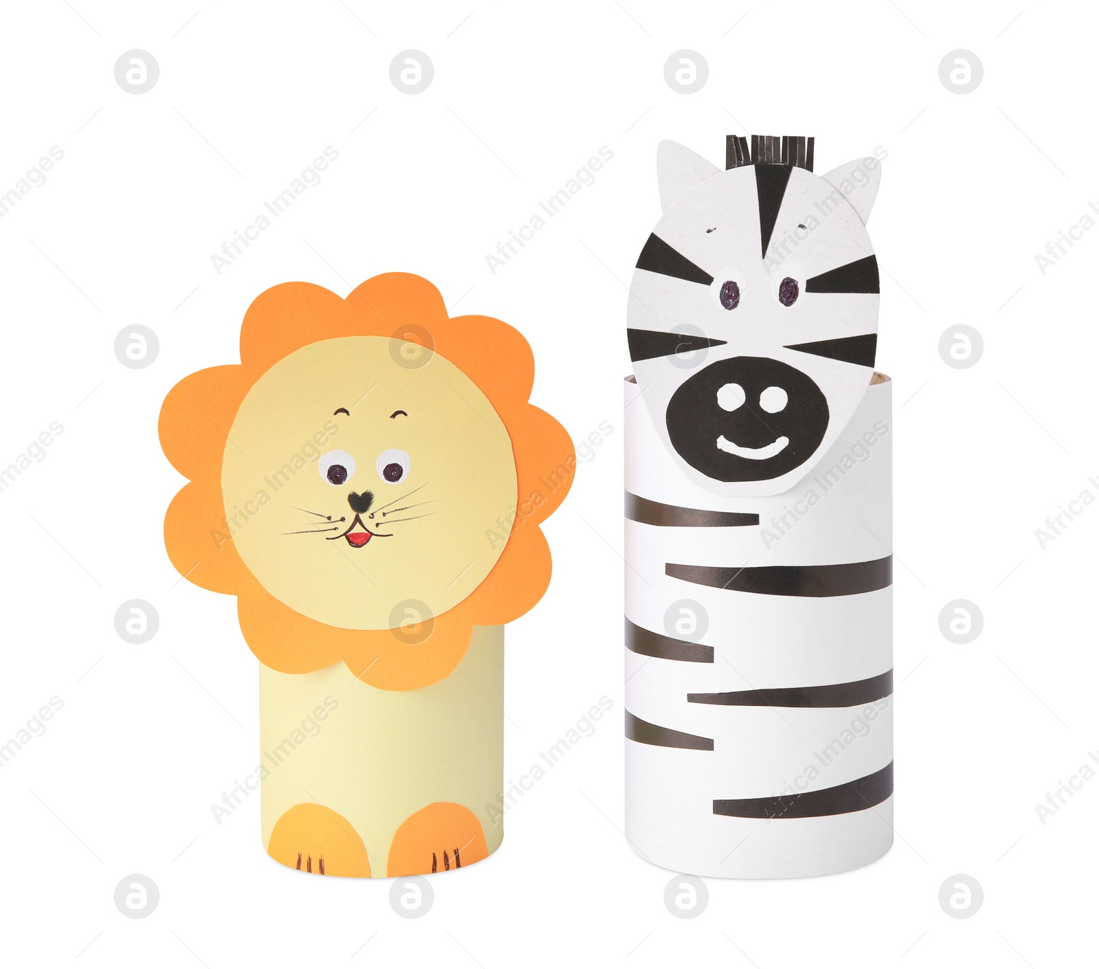Photo of Toy lion and zebra made from toilet paper hubs on white background. Children's handmade ideas