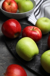 Photo of Fresh ripe green apples on black table, closeup