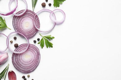 Photo of Flat lay composition with cut onion and spices on white background
