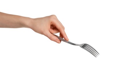 Woman holding shiny silver fork on white background, closeup