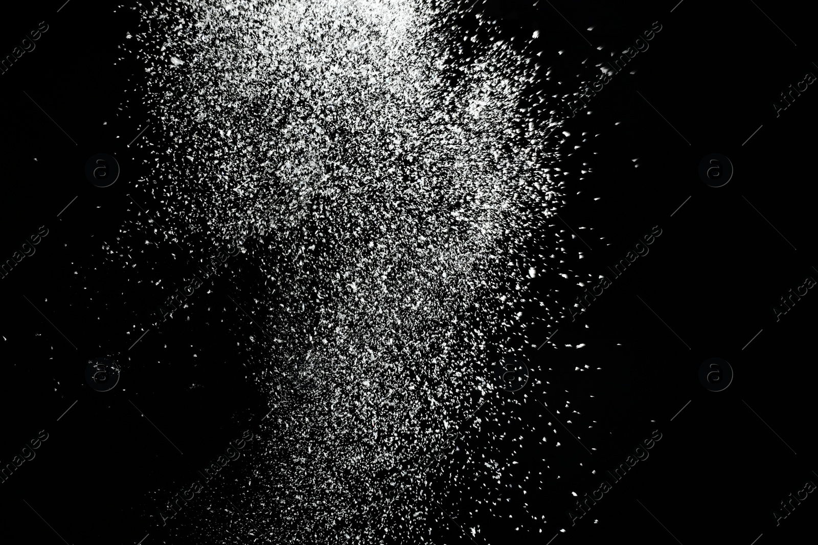 Photo of Snow flakes falling on black background. Winter weather