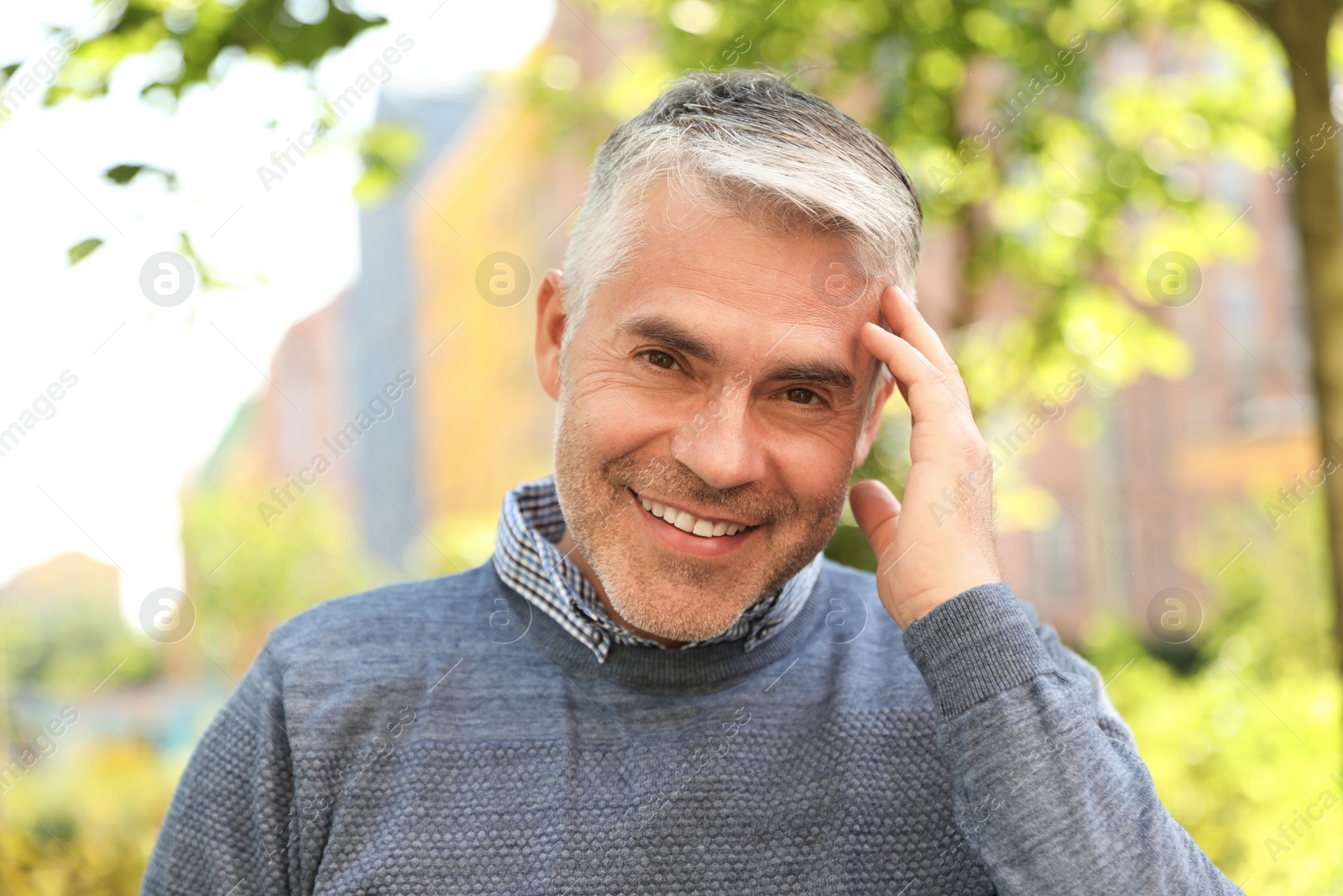 Photo of Portrait of handsome mature man in park