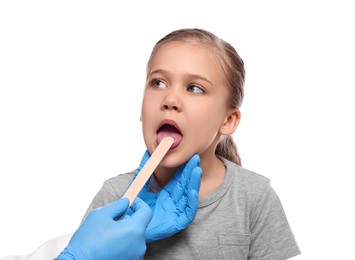 Doctor examining girl`s oral cavity with tongue depressor on white background