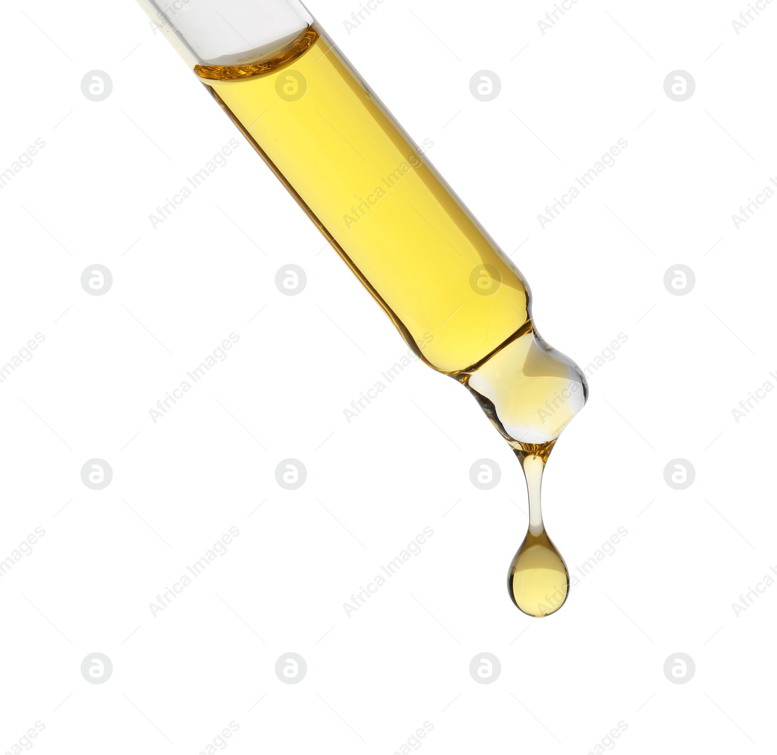 Photo of Dripping tincture from pipette isolated on white