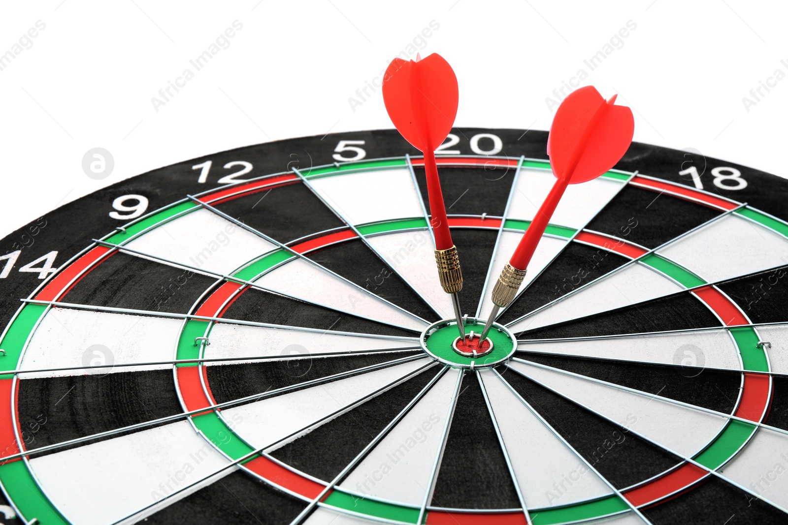 Photo of Dart board with color arrows hitting target, closeup