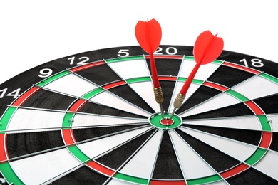 Photo of Dart board with color arrows hitting target, closeup