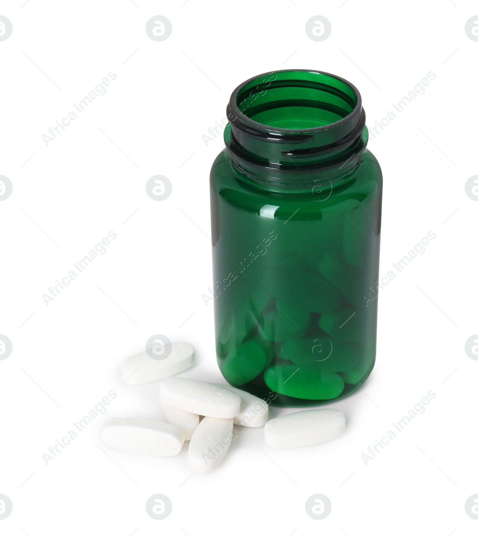 Photo of Bottle and pile of vitamin pills isolated on white