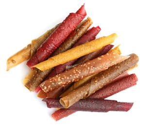 Photo of Delicious fruit leather rolls on white background, top view