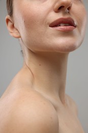 Beauty concept. Woman on grey background, closeup