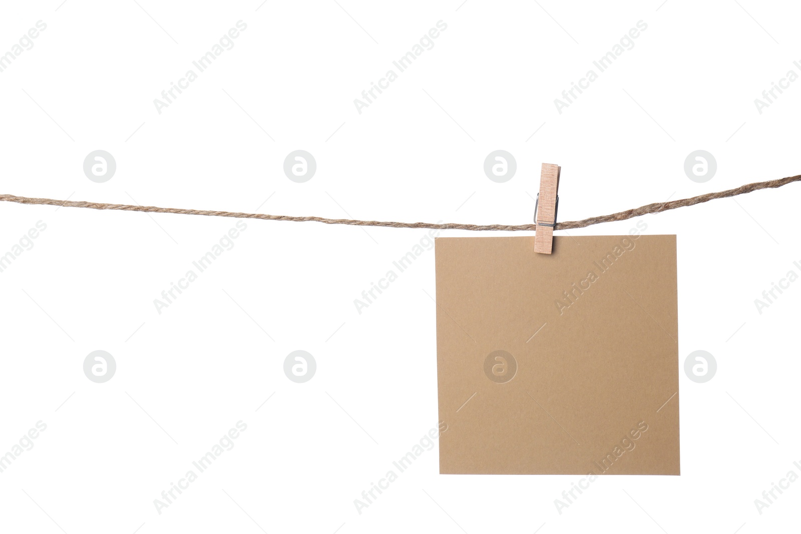 Photo of Clothespin with empty notepaper on string against white background. Space for text