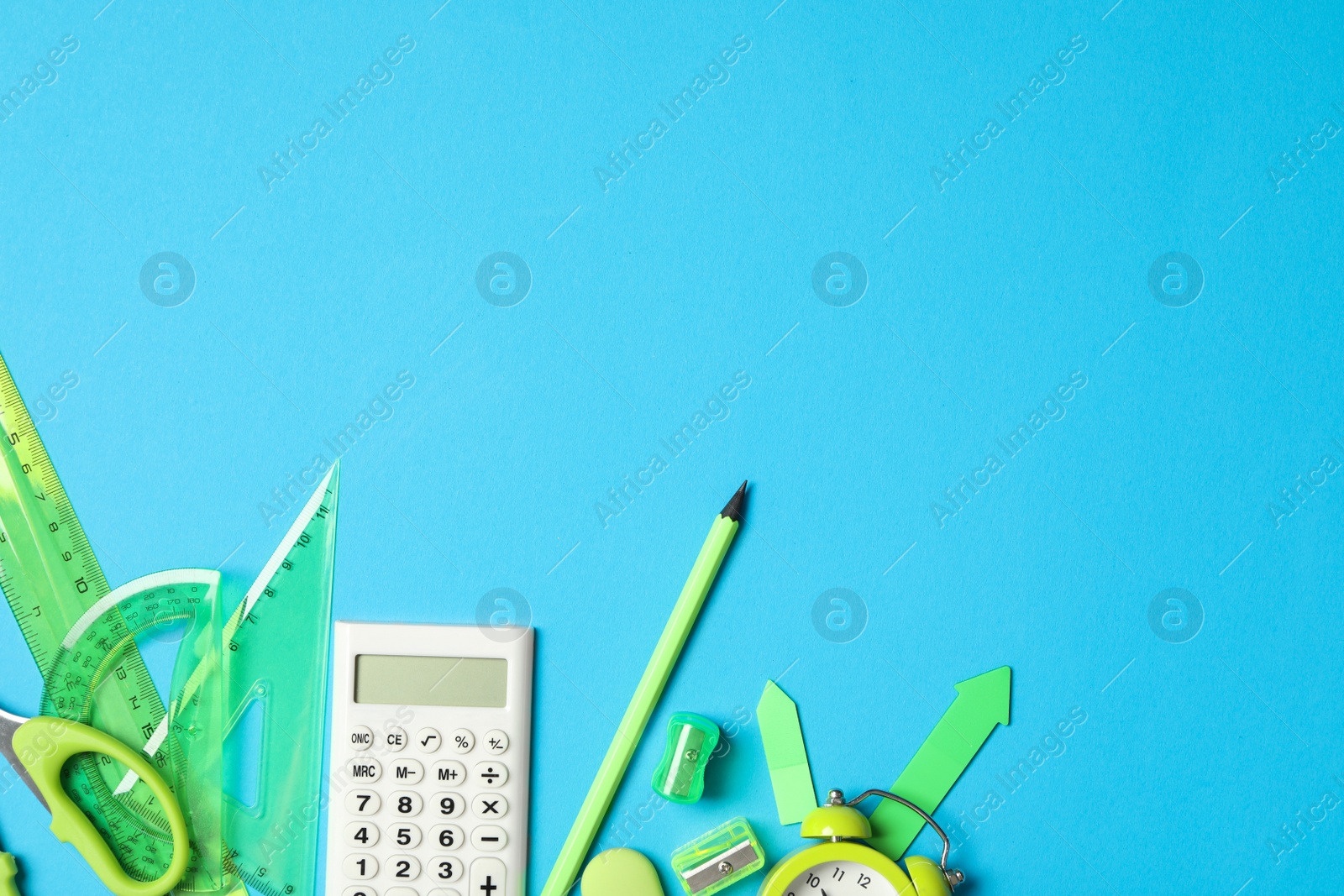 Photo of Different stationery on light blue background, flat lay with space for text. Back to school