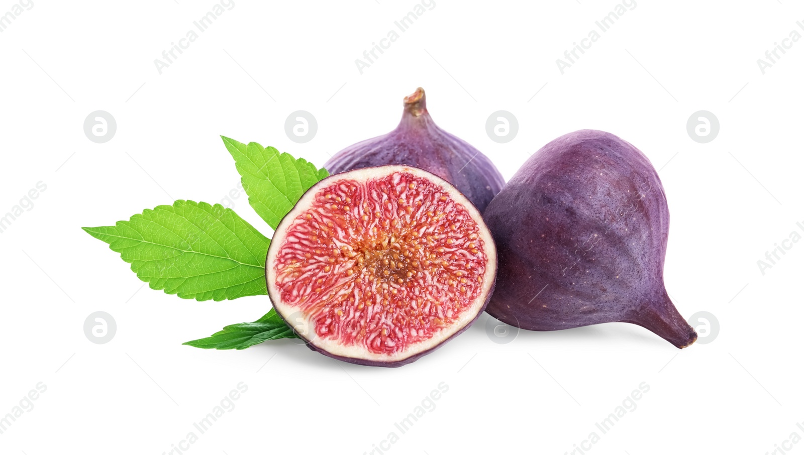 Photo of Whole and cut fresh ripe figs with green leaf isolated on white