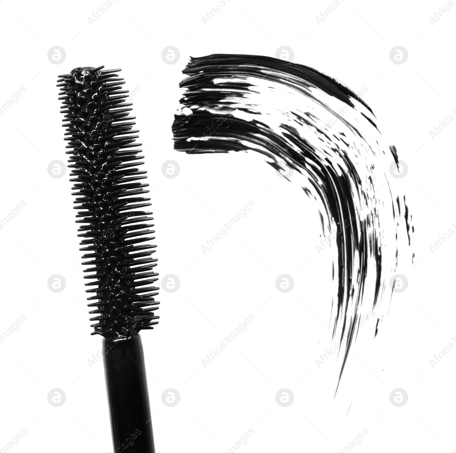 Photo of Smear of black mascara and applicator isolated on white, top view