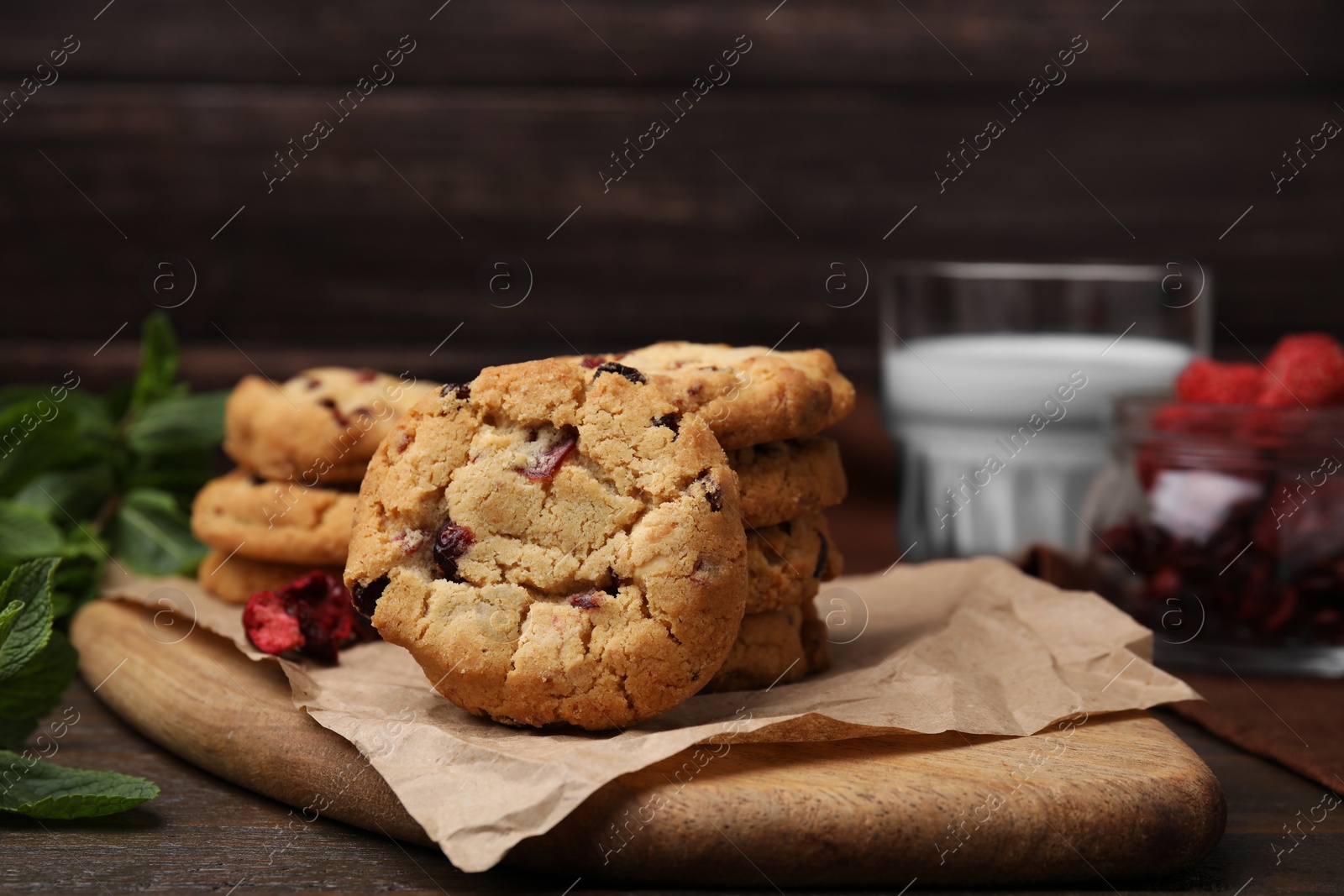 Cookies with freeze dried fruits and mint on wooden table, closeup Photo of Cookies with freeze dried fruits and mint on wooden table, closeup