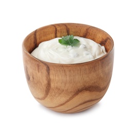 Photo of Bowl with sour cream and herbs on white background