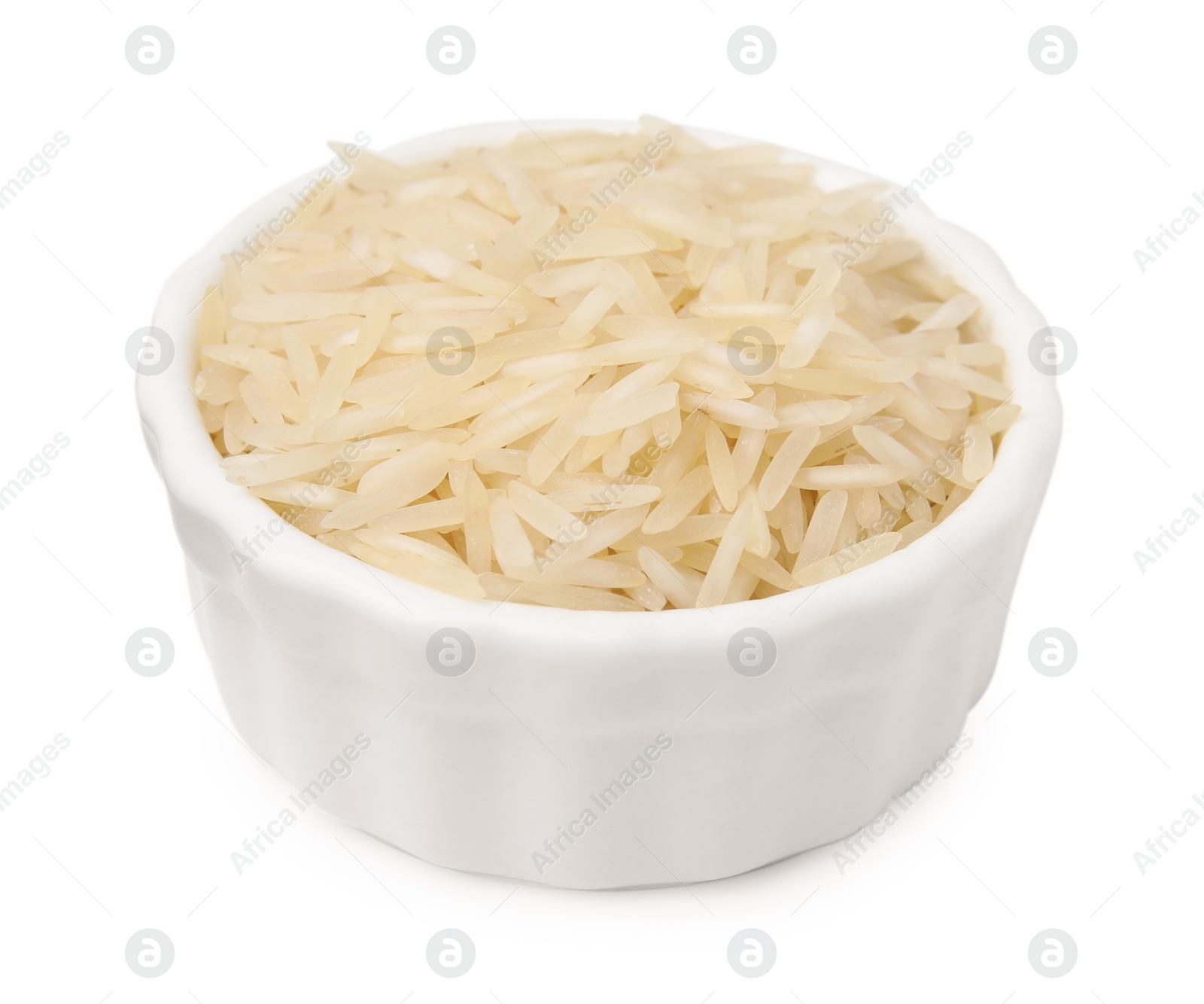 Photo of Raw rice in bowl isolated on white