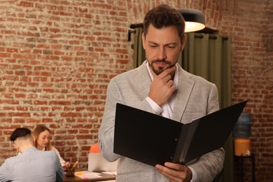 Employee working with documents in office, space for text